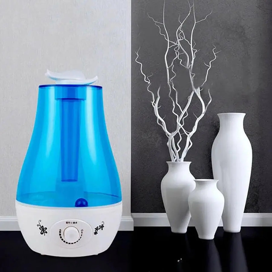 QuietAura humidifier control panel close up with mist and light buttons