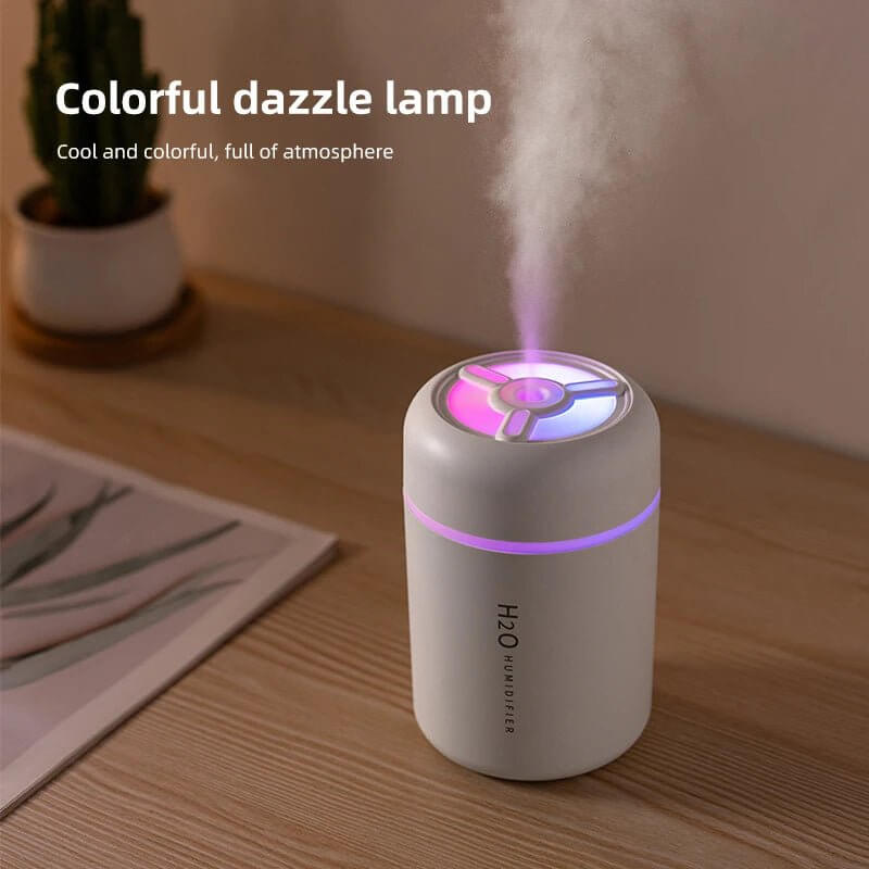 USB Mini Humidifier LED Night Light, Smart Sleep Device in use with colorful dazzle lamp effect.